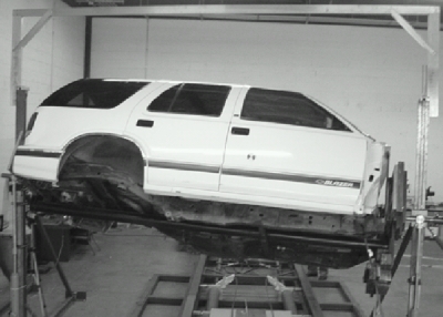 Figure B1 - Jordan Rollover System with vehicle mounted and ready for testing.