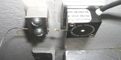 Figure B4 - The Series 150 Unit and the LVDT Glued on the Ceiling Crack of the Test House in Milwaukee, Wisconsin USA