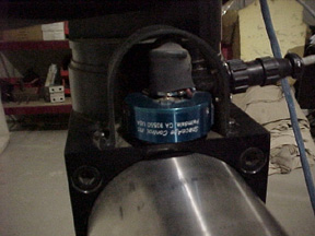 position transducer (string potentiometer) installed in test system